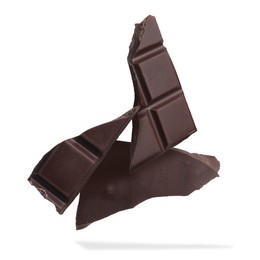 Image of Pieces of sweet chocolate falling on white background