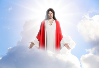 Jesus Christ in sunlight among clouds in sky