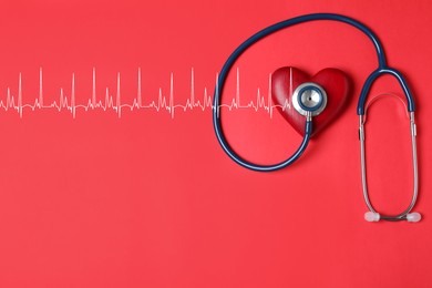 Image of Decorative heart, stethoscope and electrocardiogram on red background, top view