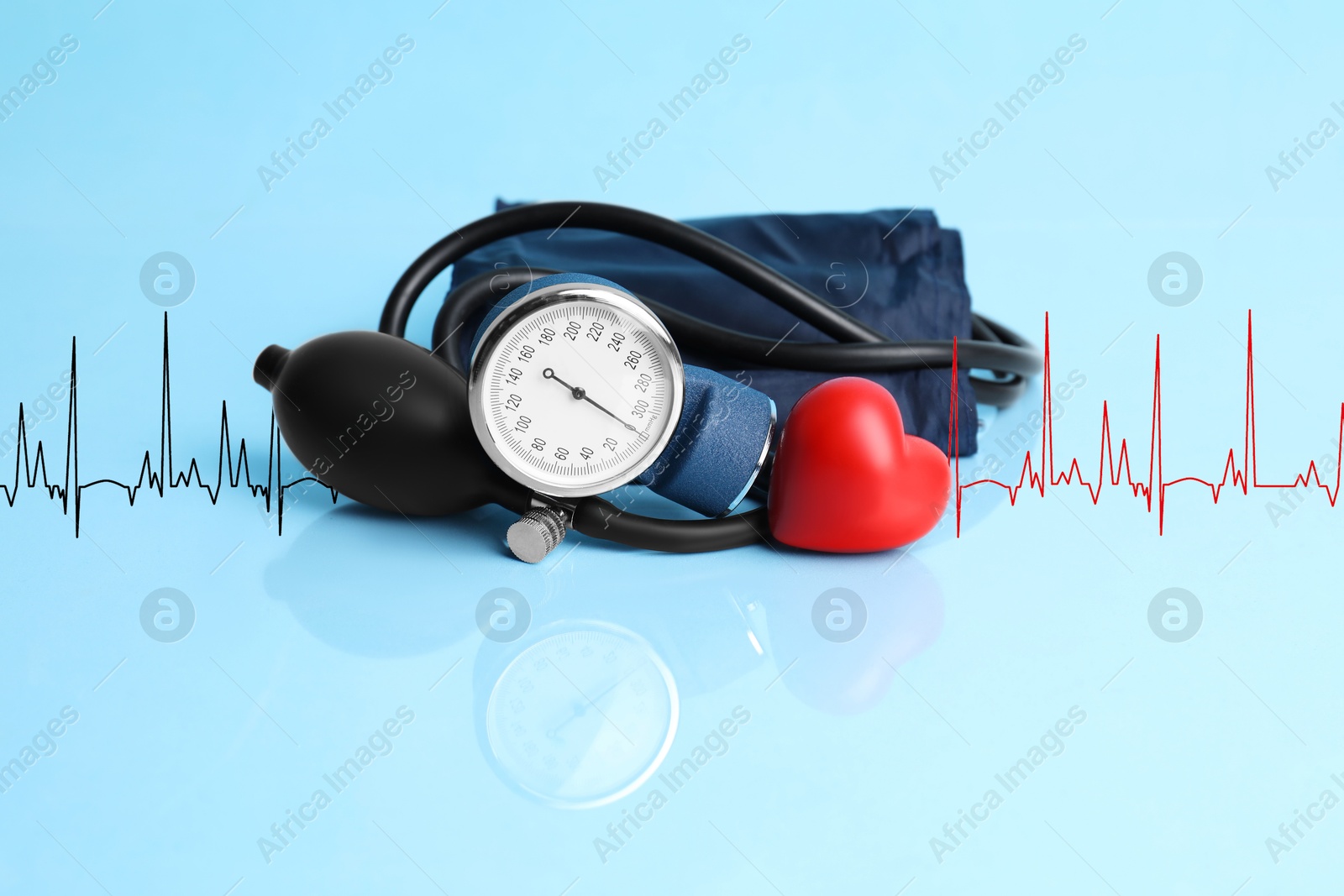 Image of Red decorative heart, electrocardiogram and blood pressure monitor on light blue background