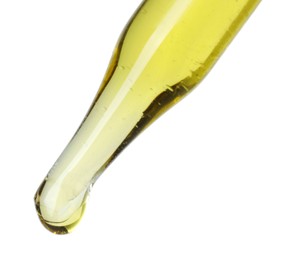 Photo of Dripping essential oil from pipette on white background