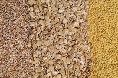 Photo of Different types of cereals as background, top view