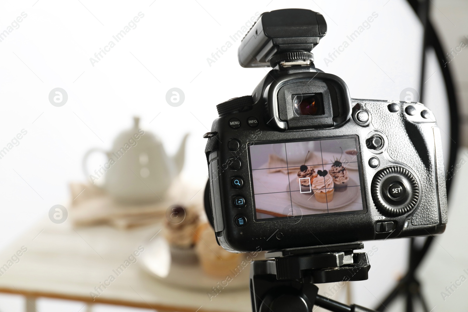 Photo of Shooting food with professional camera in photo studio, selective focus