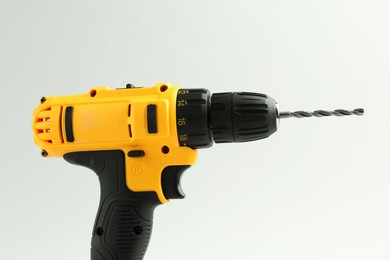 Photo of Modern cordless electric drill on white background