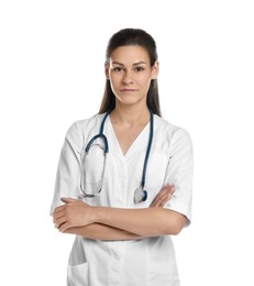 Photo of Portrait of beautiful nurse with crossed arms on white background