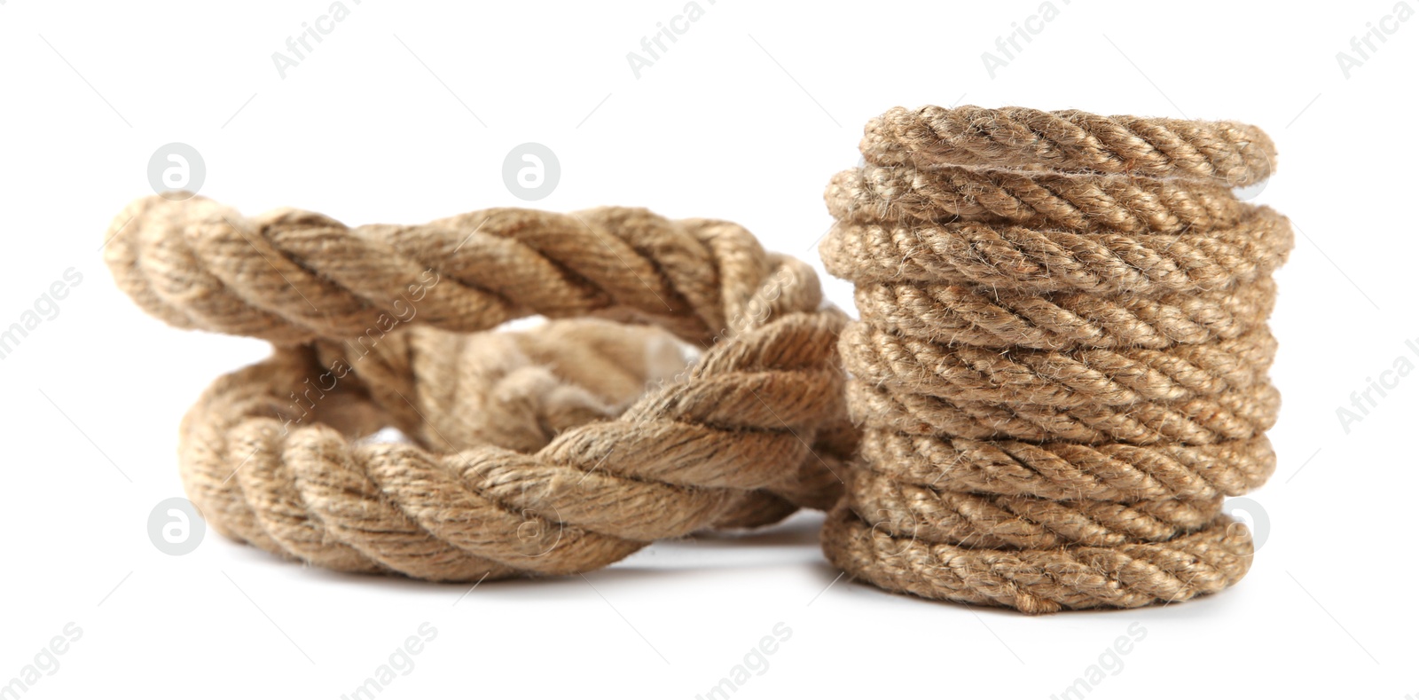 Photo of Hemp ropes isolated on white. Organic material