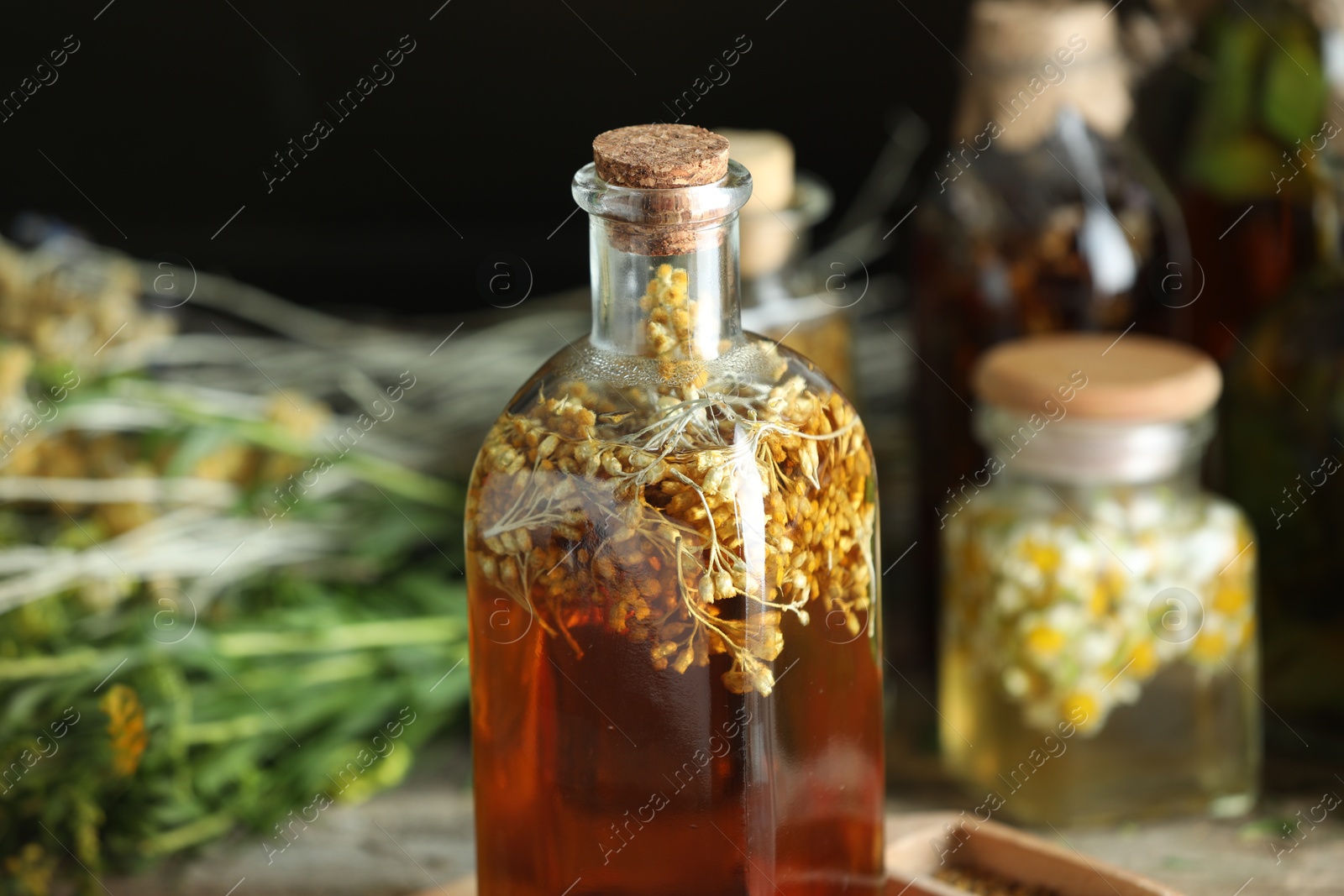 Photo of Natural tincture in bottle on table, closeup