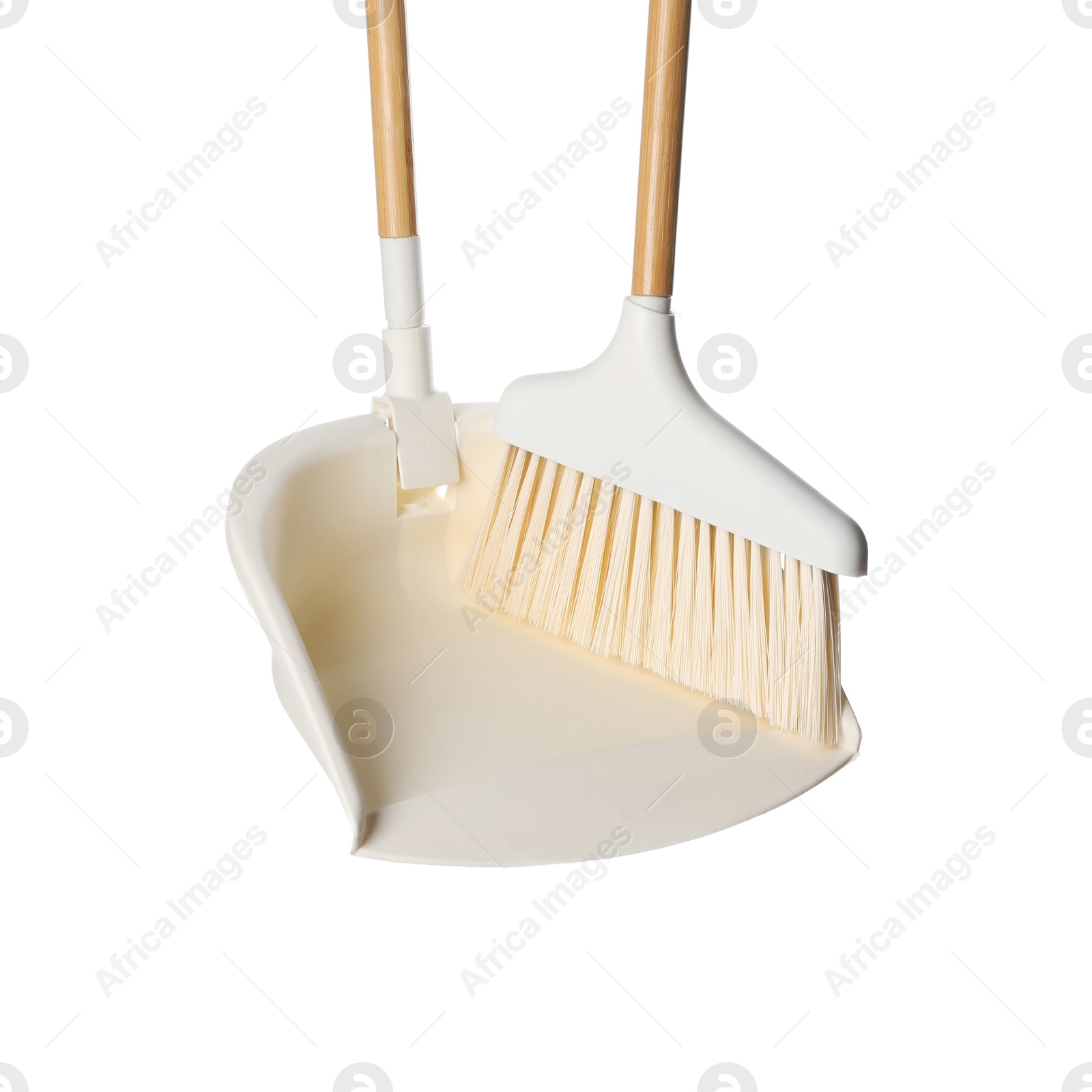 Photo of Broom and dustpan isolated on white. Cleaning tools