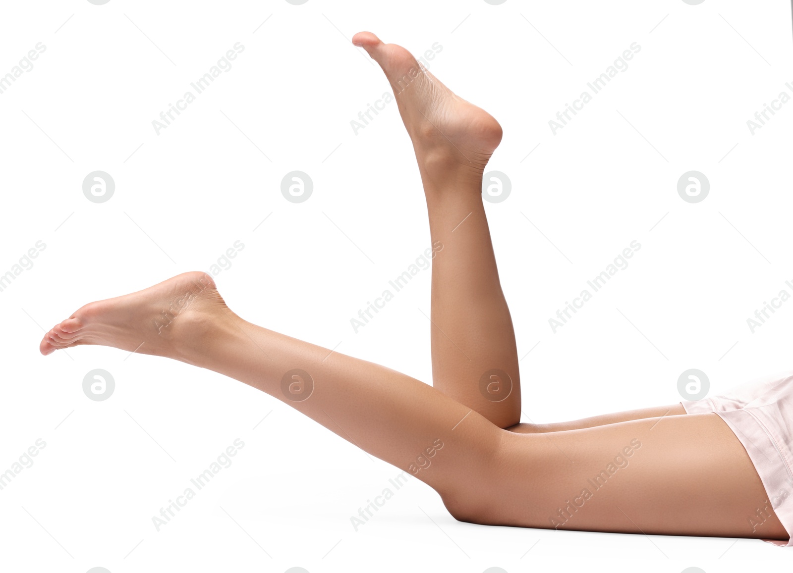 Photo of Woman with smooth legs on white background, closeup