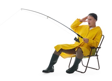 Emotional fisherman with rod on fishing chair against white background