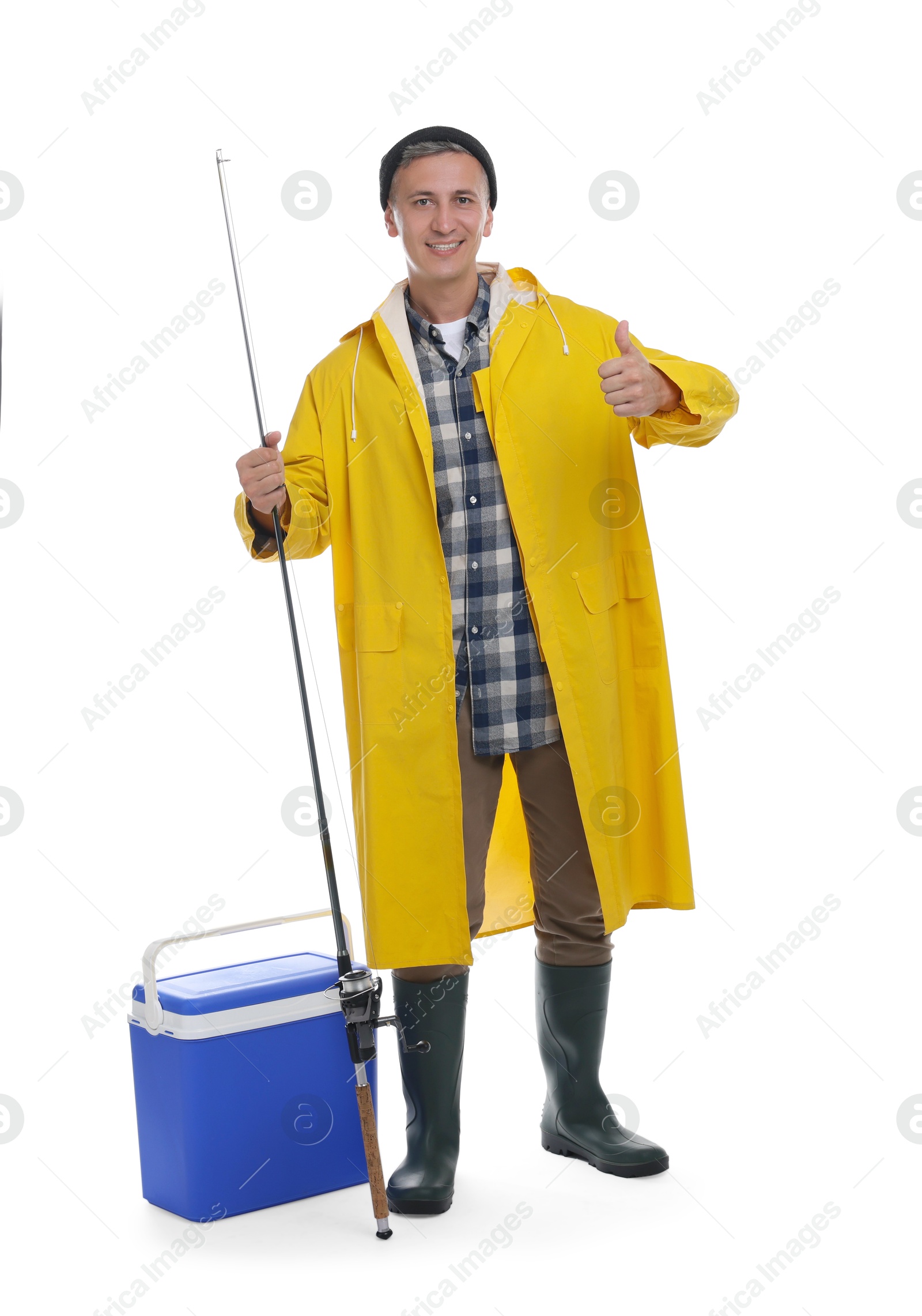 Photo of Smiling fisherman with rod showing thumbs up near cooler box on white background