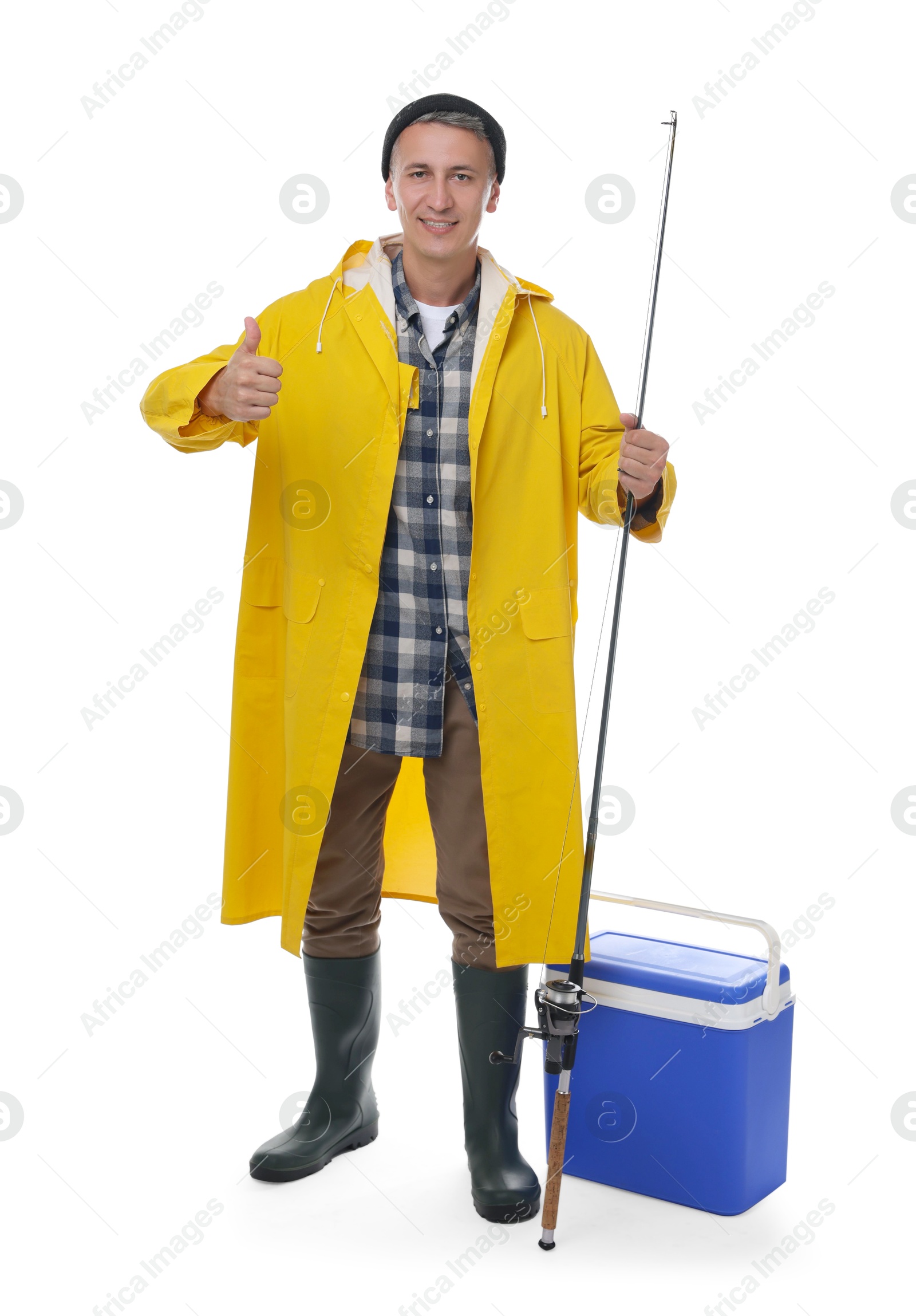 Photo of Smiling fisherman with rod showing thumbs up near cooler box on white background