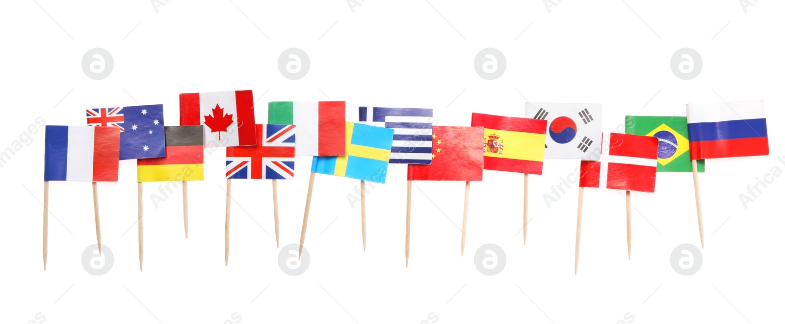 Photo of Small paper flags of different countries isolated on white