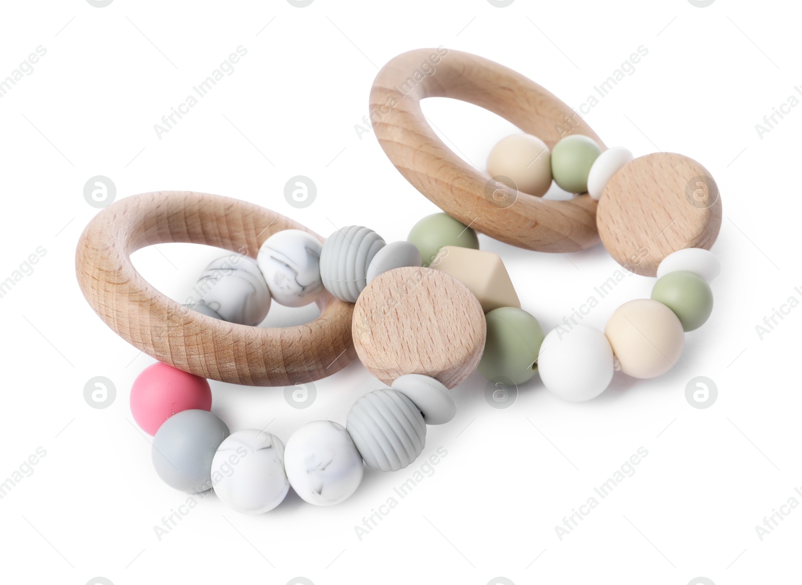 Photo of Wooden rattles isolated on white. Baby accessories