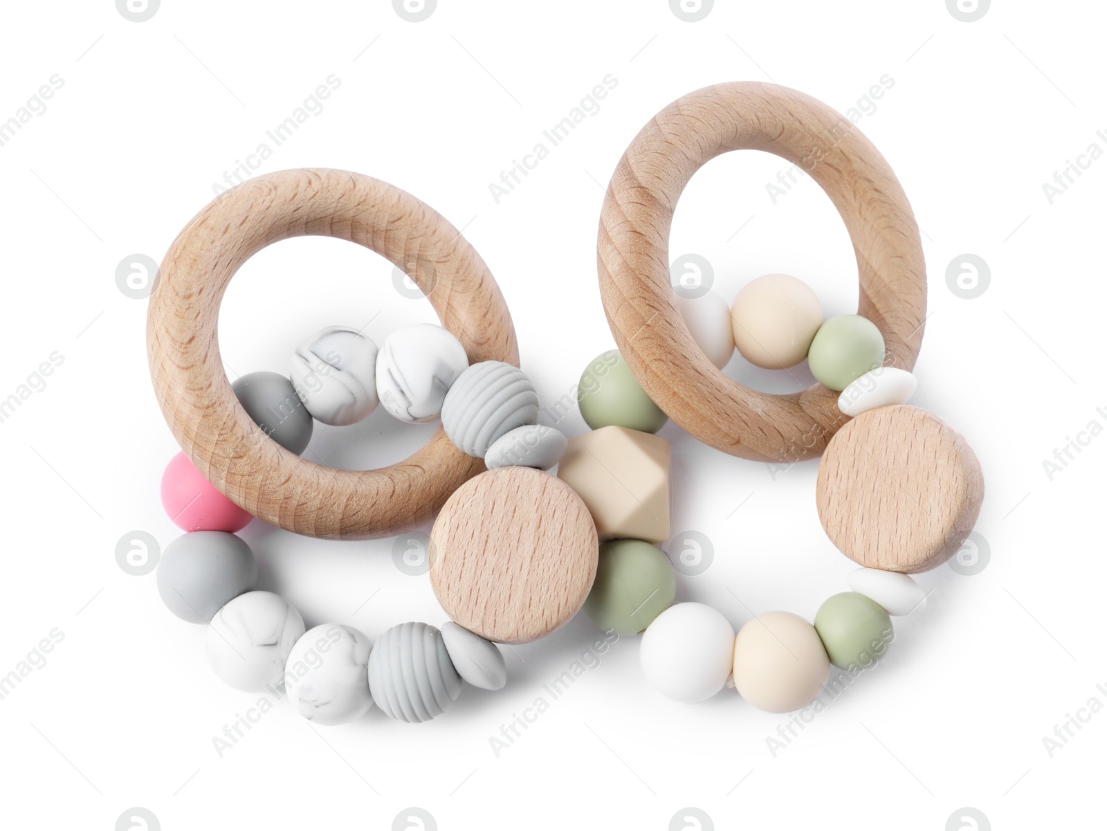 Photo of Wooden rattles isolated on white, top view. Baby accessories