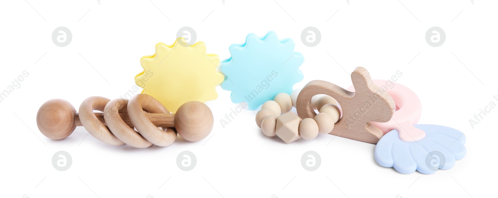 Photo of Wooden rattles isolated on white. Baby accessories