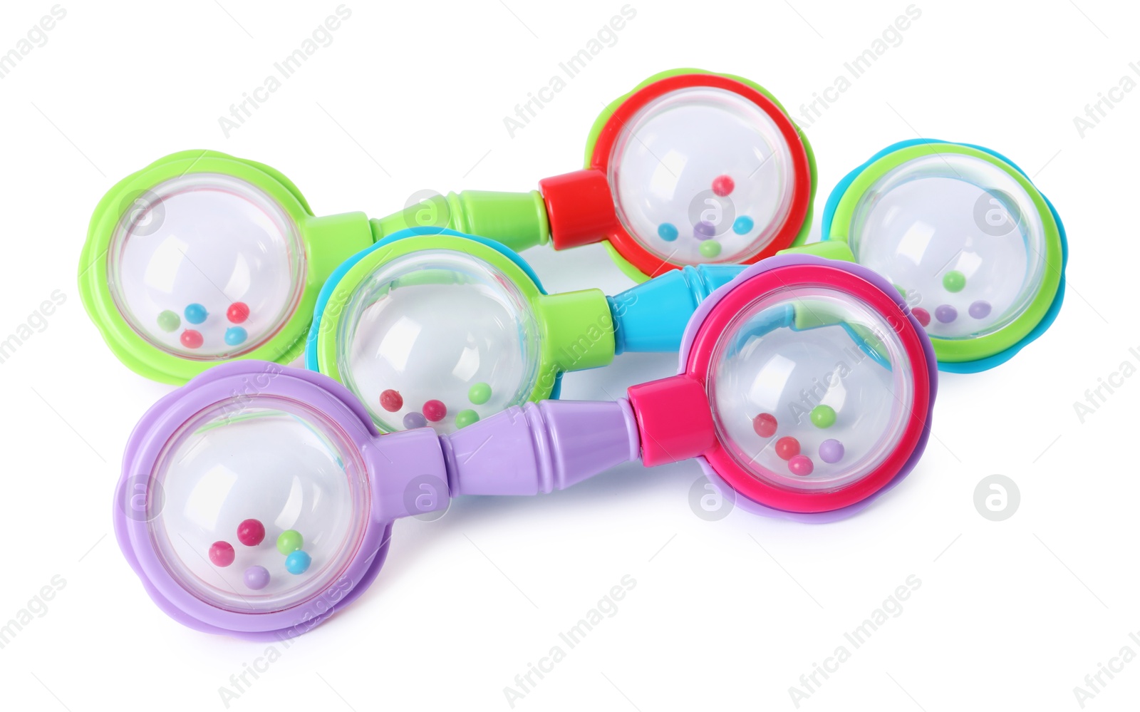 Photo of Colorful rattles isolated on white. Baby accessories