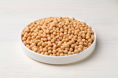 Dried peas on light wooden table, closeup