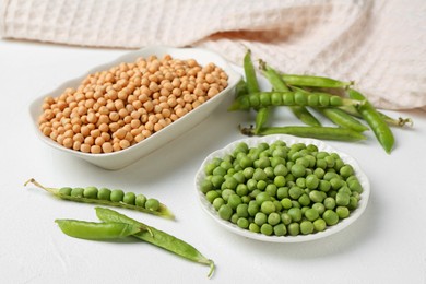 Dried, fresh peas and pods on white table, closeup