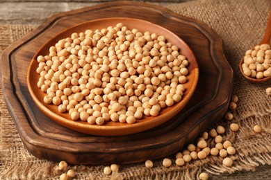 Photo of Plate with dried peas on wooden table, closeup