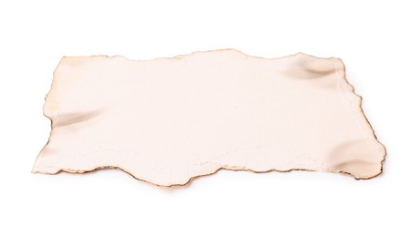 Photo of Piece of old paper with dark burnt borders isolated on white