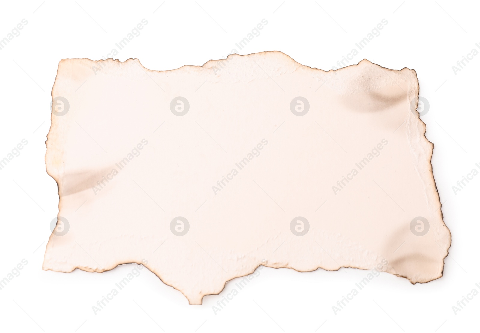 Photo of Piece of old paper with dark burnt borders isolated on white, top view