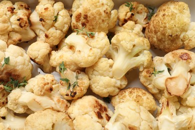 Tasty baked cauliflower in baking dish, top view