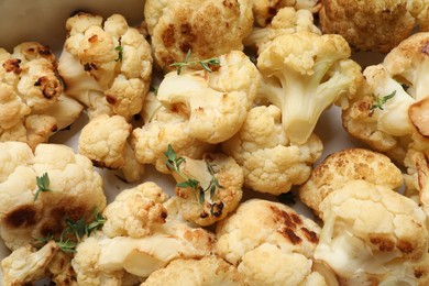 Photo of Tasty baked cauliflower in baking dish, top view