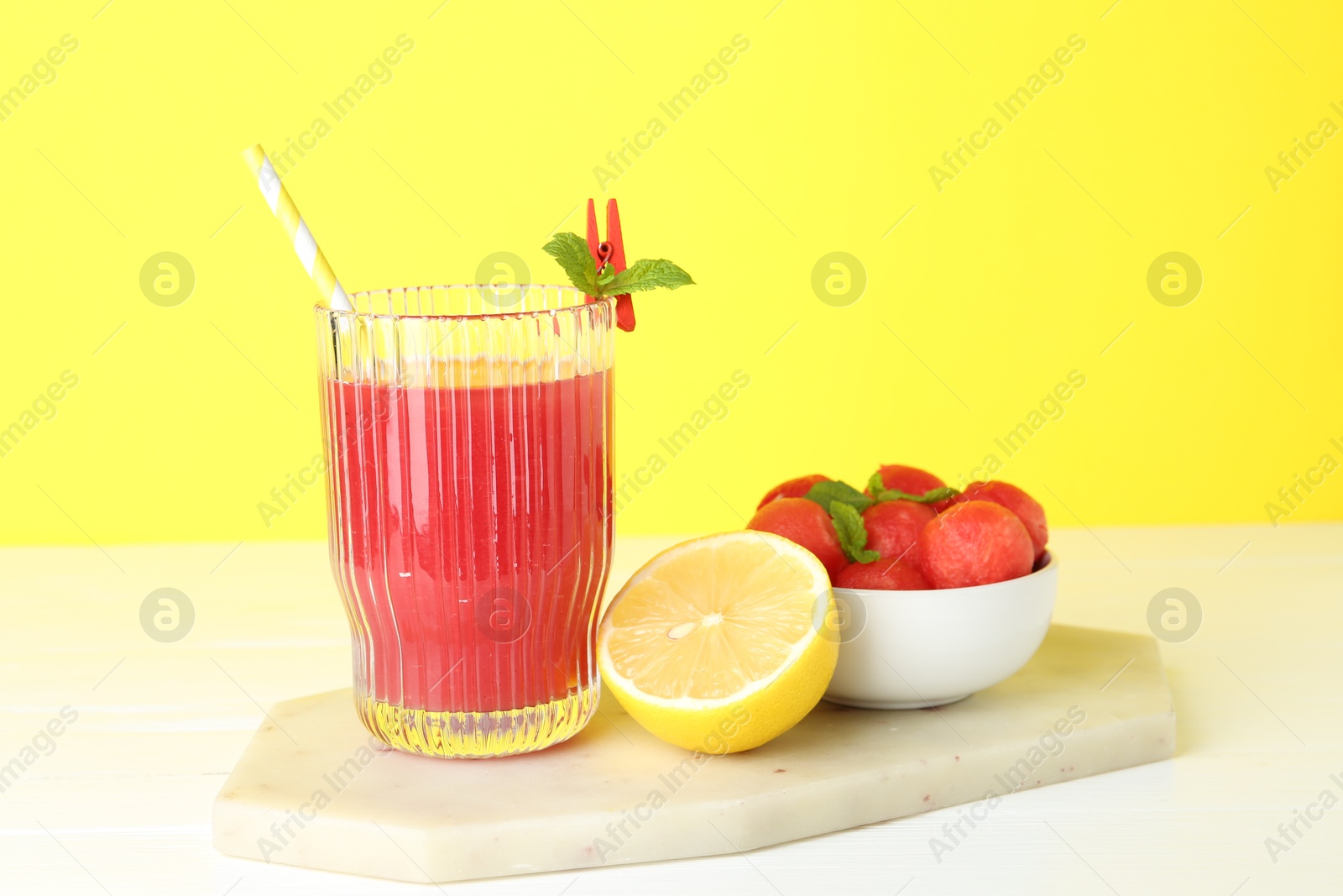 Photo of Tasty watermelon drink in glass and fresh fruits on white table