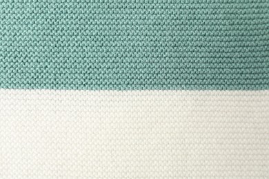 Photo of Texture of colorful knitted fabric as background, top view