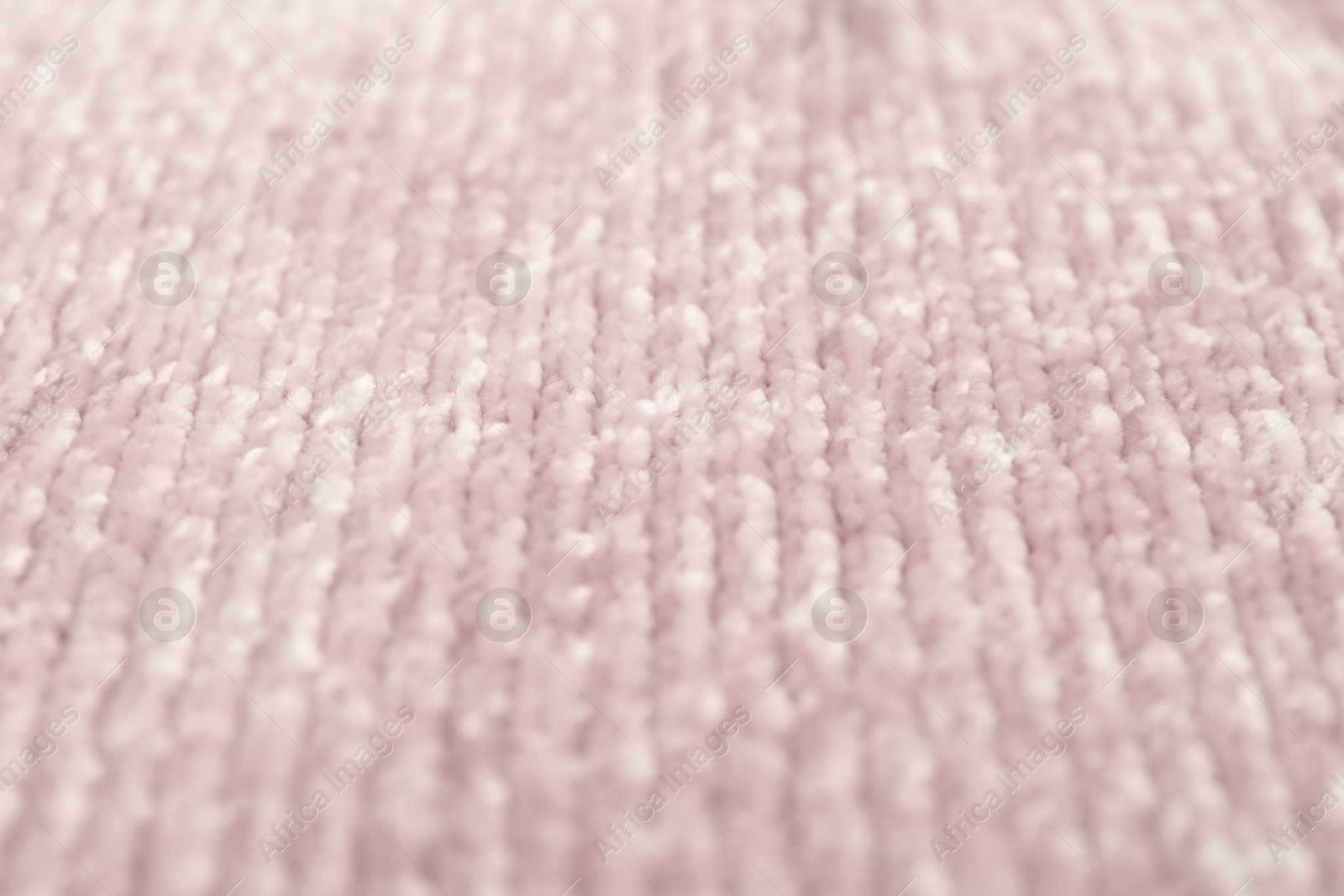 Photo of Texture of pink knitted fabric as background, closeup