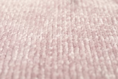 Photo of Texture of pink knitted fabric as background, closeup