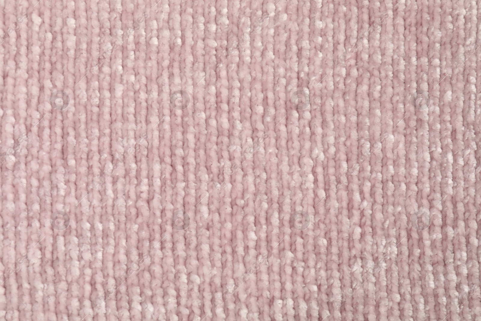 Photo of Texture of pink knitted fabric as background, top view