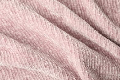 Photo of Texture of pink knitted fabric as background, top view