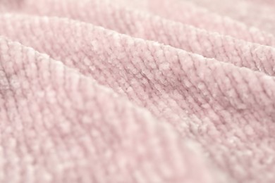 Photo of Texture of pink knitted fabric as background, closeup