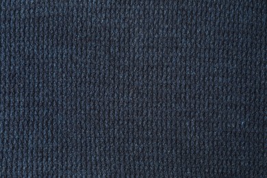 Texture of dark blue knitted fabric as background, top view