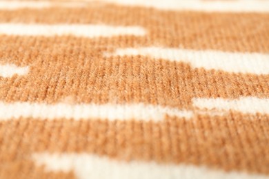 Photo of Texture of bright knitted fabric with pattern as background, closeup