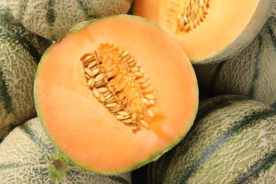 Many ripe Cantaloupe melons as background, top view