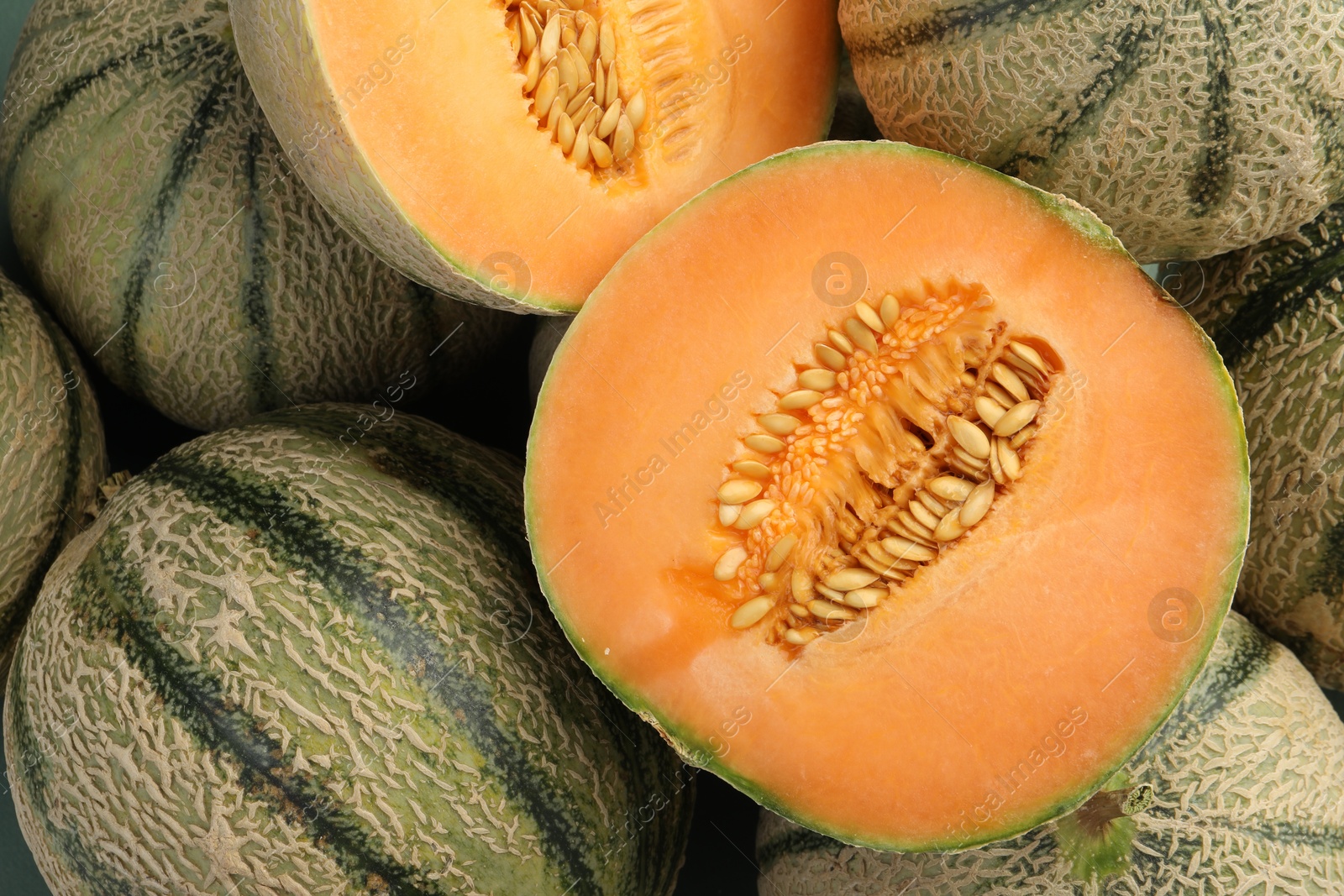 Photo of Many ripe Cantaloupe melons as background, top view