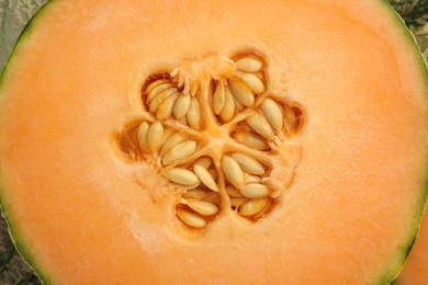 Cut Cantaloupe melon as background, top view