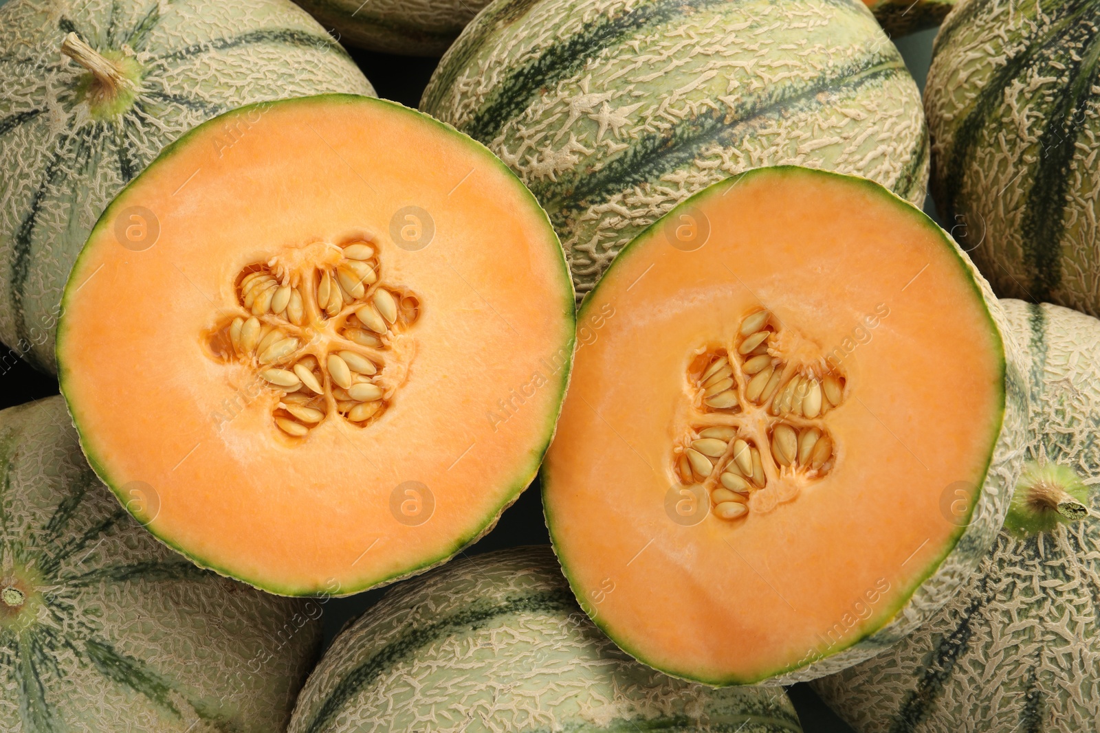 Photo of Many ripe Cantaloupe melons as background, top view