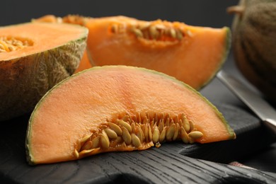 Photo of Fresh ripe Cantaloupe melon on table, closeup