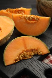 Photo of Fresh ripe Cantaloupe melon on table, closeup