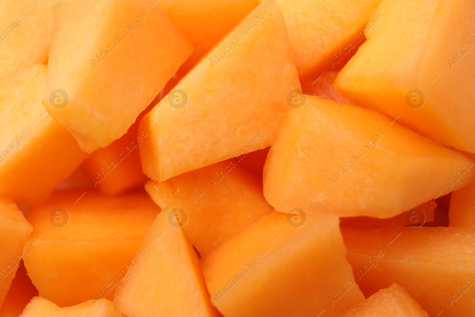 Photo of Pieces of Cantaloupe melon as background, top view