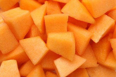 Photo of Pieces of Cantaloupe melon as background, top view