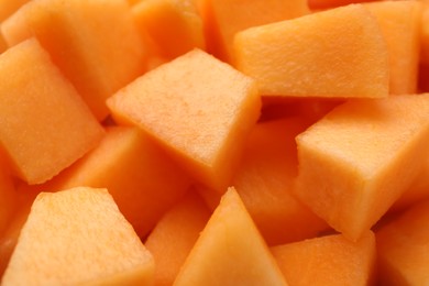 Photo of Pieces of Cantaloupe melon as background, top view