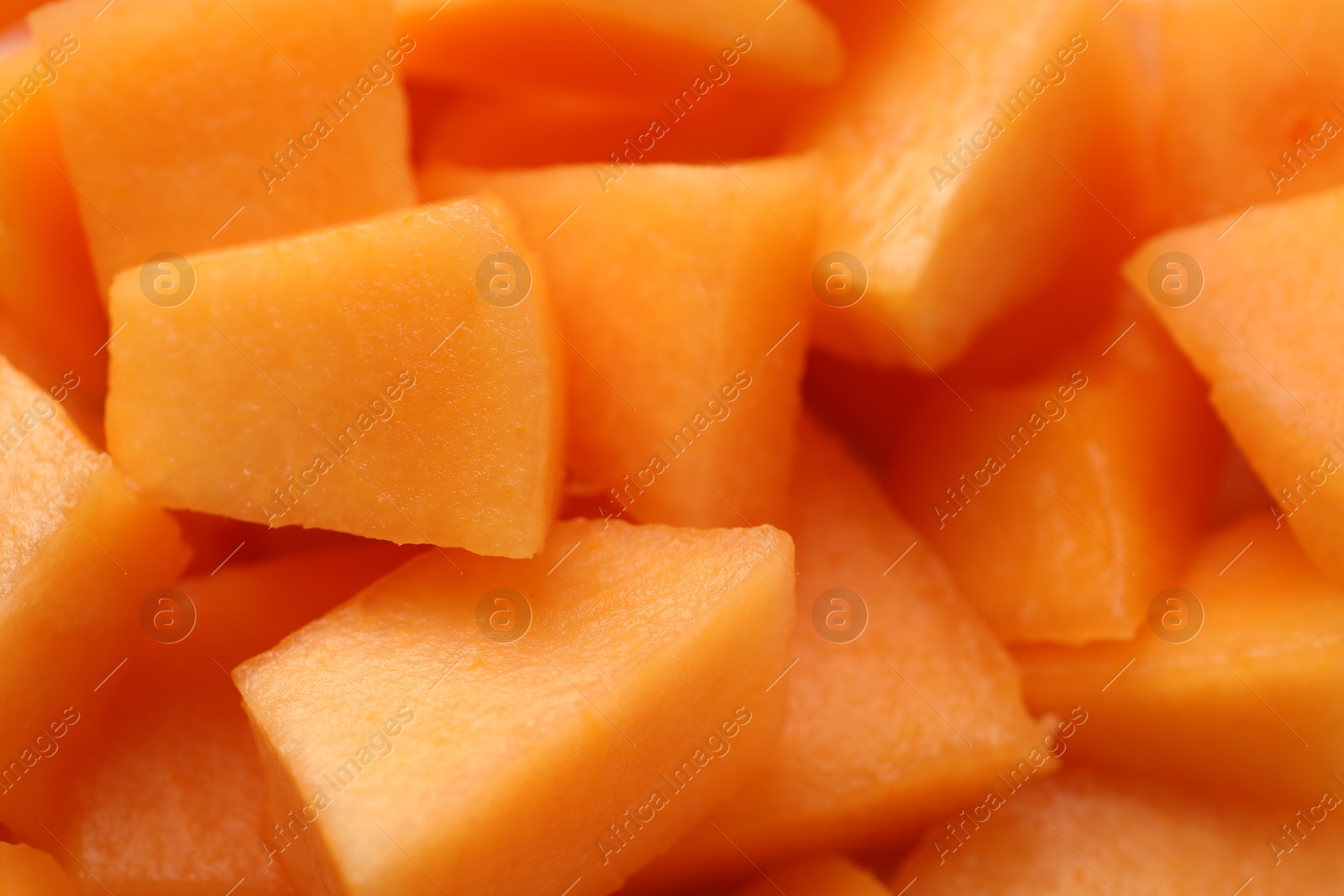 Photo of Pieces of Cantaloupe melon as background, top view