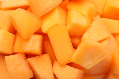 Photo of Pieces of Cantaloupe melon as background, top view