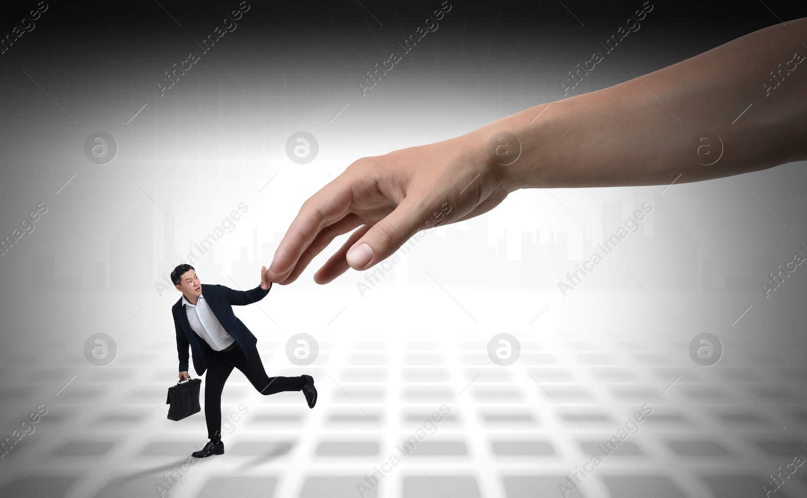 Image of Running away small businessman pushing back big hand on light background. Authority, abuse concepts