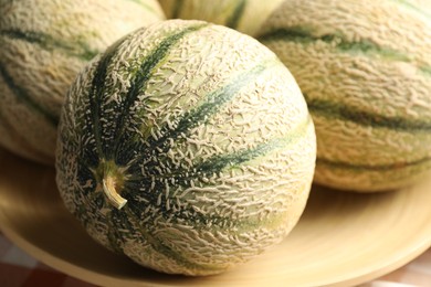 Photo of Tasty ripe Cantaloupe melons on table, closeup